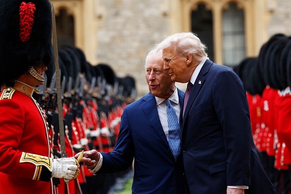 WINDSOR, ENGLAND - SEPTEMBER 17: King Charles III and US President Donald Trump inspect the Guard of Honour during the State visit by the President of the United States of America at Windsor Castle on ...