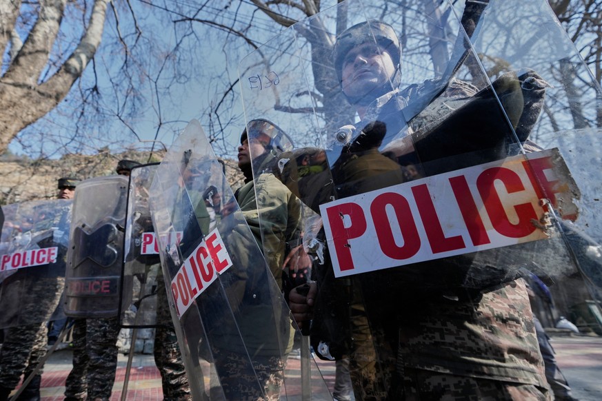 Indian soldiers guard outside the office of the United Nations Military Observer Group in India and Pakistan (UNMOGIP) during a protest against the killing of Iran's Supreme Leader Ayatollah Ali  ...