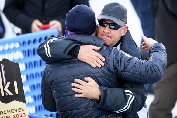 Alexis Pinturault of France, left, cheers with Johan Carl Eliasch, right, President of the International Ski Federation FIS, in the finish area during the slalom run of the men&#039;s alpine combined  ...