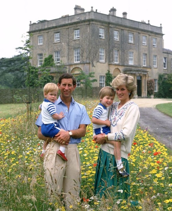 UNITED KINGDOM - JULY 14: Prince Charles, Prince of Wales and Diana, Princess of Wales with their sons Prince William &amp; Prince Harry in the wild flower meadow at Highgrove (Photo by Tim Graham Pho ...