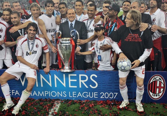 AC Milan&#039;s Silvio Berlusconi with the trophy as he stands with his team after they beat Liverpool 2-1 to win the Champions League Final soccer match between AC Milan and Liverpool at the Olympic  ...