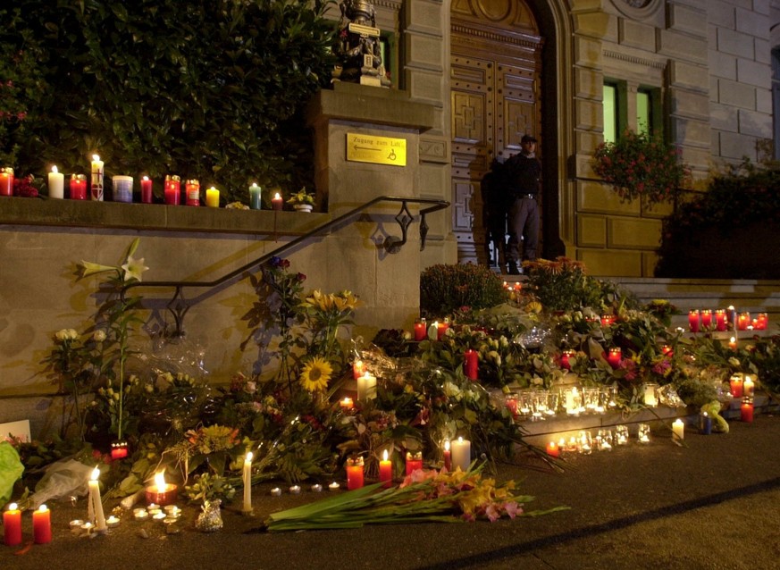 Candles and flowers lay on the stairs to the Parliament's building in memory of the victims of the shooting, Thursday, 27 September 2001. A gunman had stormed the Parliaments assembly and opened  ...