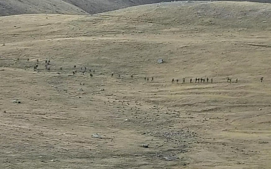 This image taken from a YouTube footage released by Armenian Defense Ministry on Tuesday, Sept. 13, 2022, shows Azerbaijanian servicemen crossing the Armenian-Azerbaijani border and approaching the Ar ...