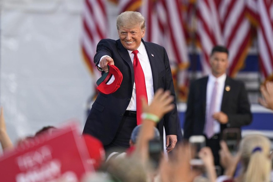 Former President Donald Trump points to a supporter before speaking at a rally at the Lorain County Fairgrounds, Saturday, June 26, 2021, in Wellington, Ohio. (AP Photo/Tony Dejak)