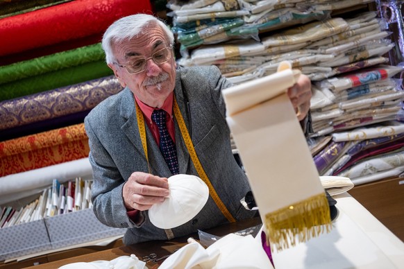 Italian tailor Raniero Mancinelli nearly finishes tailoring the white cassocks for the future Pope in his shop in Rome, Italy, on May 5, 2025. Raniero Mancinelli, 86, has personally handcrafted the ca ...