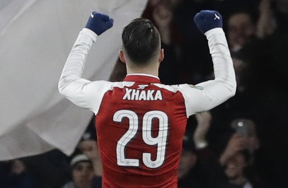 Arsenal&#039;s Granit Xhaka celebrates after scoring his side second goal during the English League Cup semifinal second leg soccer match between Chelsea and Arsenal at the Emirates stadium in London, ...