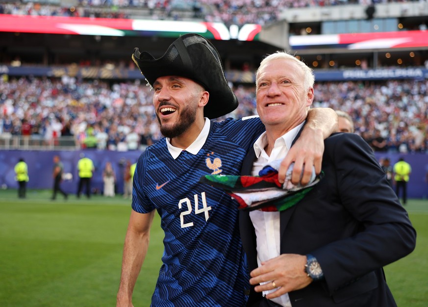 PHILADELPHIA, PENNSYLVANIA - JULY 04: Didier Deschamps, Head Coach of France, celebrates with Rayan Cherki #24 after the 1-0 victory during the FIFA World Cup 2026 Round of 16 match between Paraguay a ...