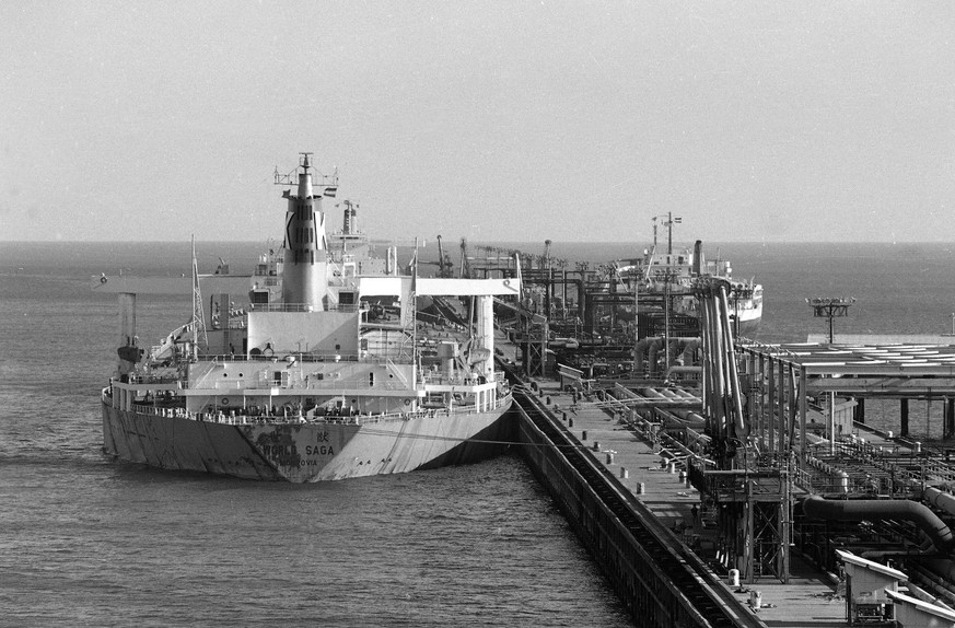 An oil tanker, loads crude oil on Kharg Island, Teheran, Iran, Nov. 13, 1979. The terminal in the Persian Gulf has stopped exporting oil to the U.S. (AP Photo/Mohammad Sayyad)