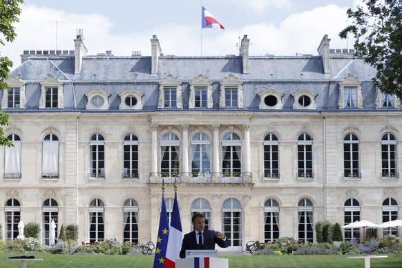 FILE - French President Emmanuel Macron delivers his speech during a meeting with members of the Citizens&#039; Convention on Climate to discuss over environment proposals at the Elysee Palace in Pari ...