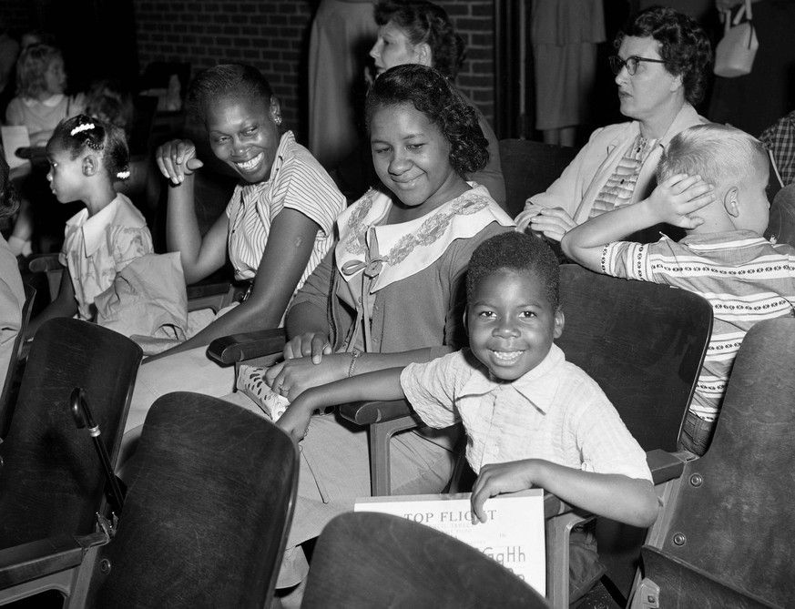 News: Desegregation of Nashville Schools Sept 9, 1957 Nashville, TN, USA First grader Marvin Moore, right, is all smiles as his mother, Maude Baxter, and Mary Louise Watson, with her daughter Barbara  ...