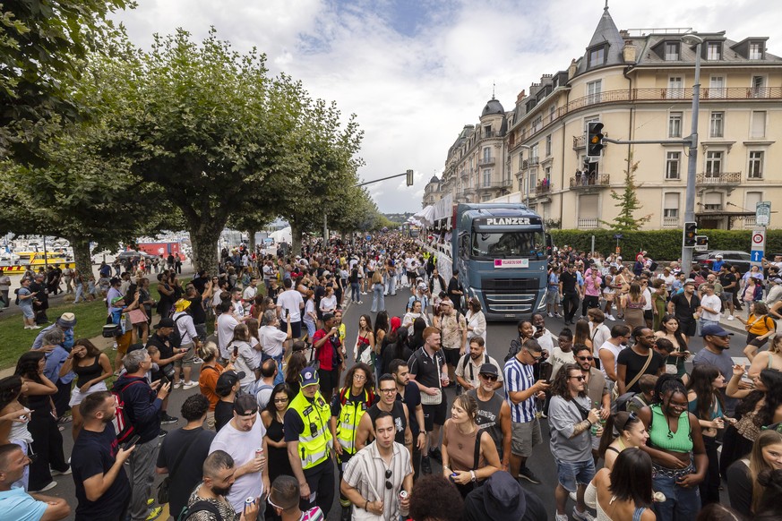 Ravers dance on and around Lake Mobiles during the 23nd edition of the Lake Parade, in Geneva, Switzerland, Saturday, July 26, 2025 (KEYSTONE/Cyril Zingaro)
