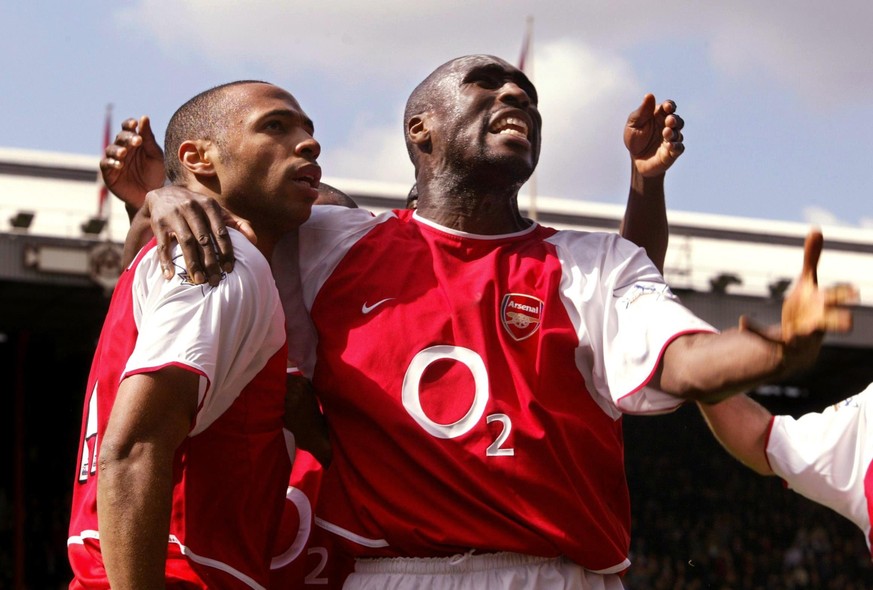 Arsenal's Thierry Henry (left) celebrates his first goal against Liverpool, with team-mate Sol Campbell during the Barclaycard Premiership match at Highbury, north London. Arsenal won 4-2. THIS P ...