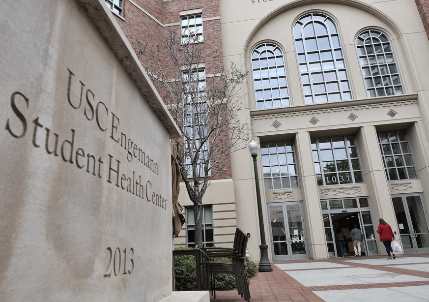 FILE - In this May 22, 2018, file photo, people enter the University of Southern California&#039;s Engemann Student Health Center in Los Angeles. The University of Southern California has agreed to an ...