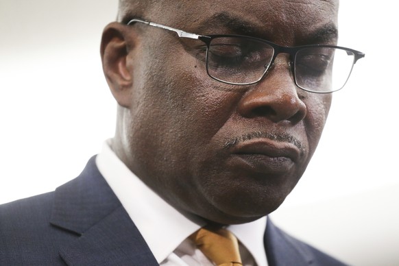 Buffalo Mayor Byron Brown takes a moment of silence and prayer following a shooting at a supermarket on Saturday, May 14, 2022, in Buffalo, N.Y. (AP Photo/Joshua Bessex)