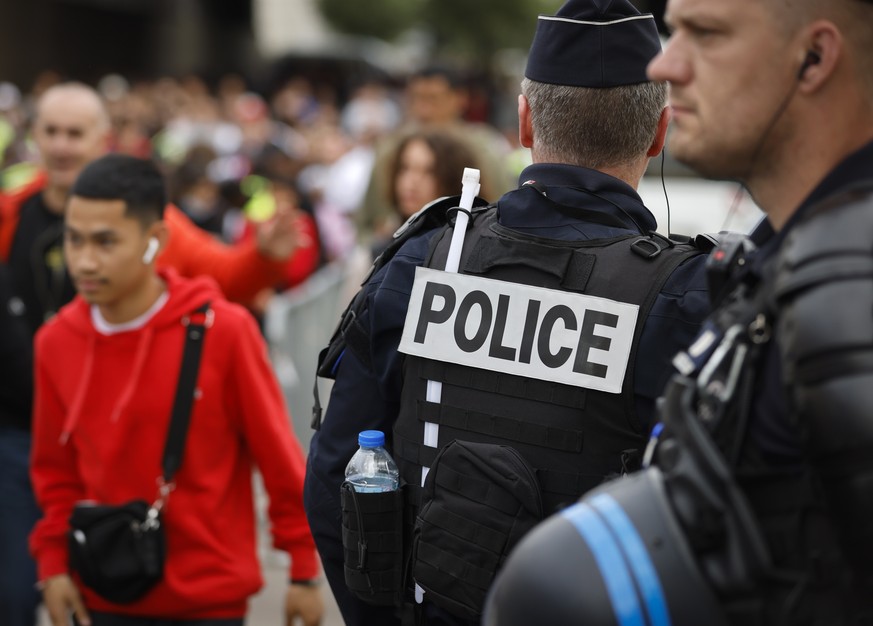 Police officers stand guard ahead the UEFA Nations League soccer match between France and Denmark at the Stade de France in Saint Denis near Paris, France, Friday, June 3, 2022. (AP Photo/Jean-Francoi ...