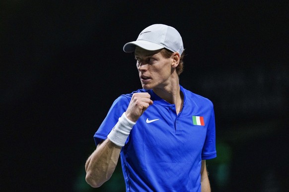 Jannik Sinner of Italy celebrates a point against Novak Djokovic of Serbia during a Davis Cup semi-final tennis match between Italy and Serbia in Malaga, Spain, Saturday, Nov. 25, 2023. (AP Photo/Manu ...