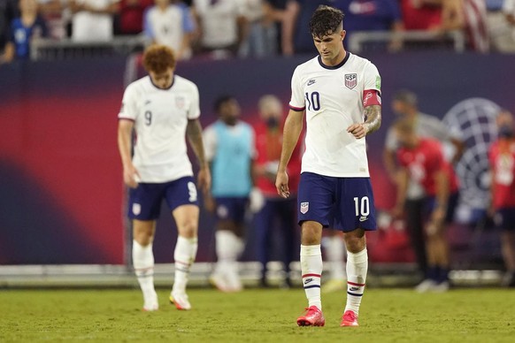 United States forwards Christian Pulisic (10) and Josh Sargent (9) leave the pitch following a 1-1 draw with Canada in a World Cup soccer qualifier Sunday, Sept. 5, 2021, in Nashville, Tenn. (AP Photo ...