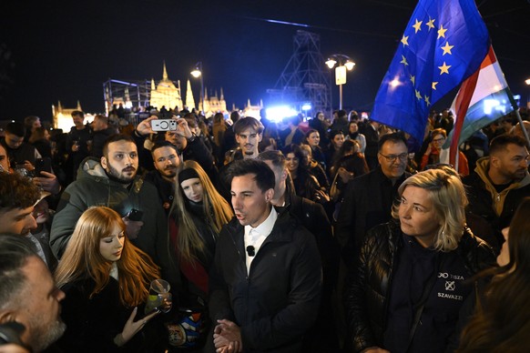 epa12886014 Vice Chairman of the Tisza Party Mark Radnai (C) speaks at the party's election night event after the party won a landslide victory in the general elections in Budapest, Hungary, 12 A ...