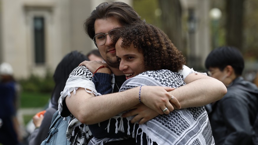 epa11310999 Students embrace as they begin the process of dissolving the encampment on the Main Green at Brown Univeristy in Providence, Rhode Island, USA, 30 April 2024. Brown University leaders and  ...