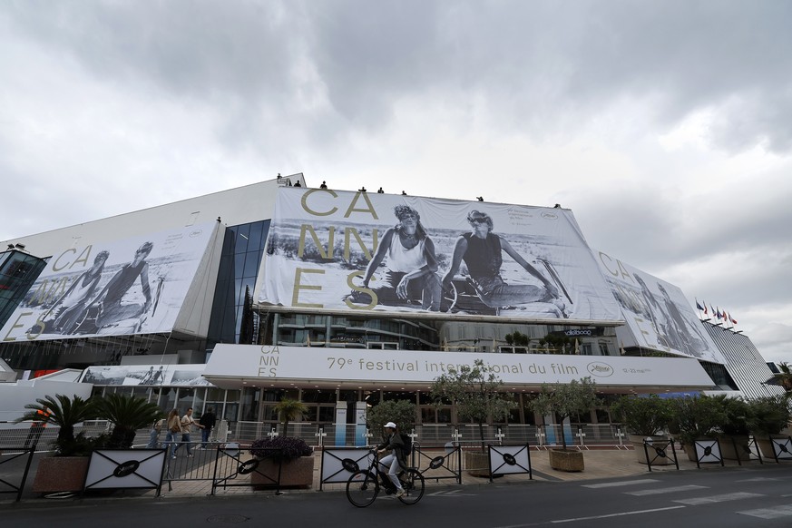 epa12944972 Workers set up the official poster of the 79th annual Cannes Film Festival on the Palais des Festivals facade in Cannes, France, 10 May 2026. The film festival runs from 12 to 23 May 2026. ...