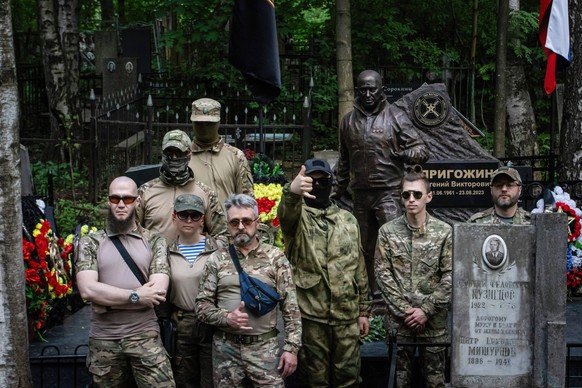 Unveiling of a monument to Wagner s chief Prigozhin in St. Petersburg, Russia - 1 Jun 2024 Soldiers of the Wagner PMC during a group photo near the installed sculpture of the head of the Wagner PMC, E ...