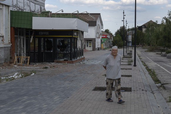 A local resident walks past at a city centre in Sudzha, Kursk region, Russia, Friday, Aug. 16, 2024. This image was approved by the Ukrainian Defense Ministry before publication. (AP Photo)