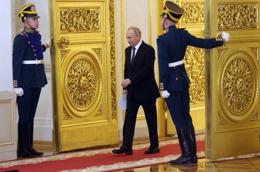 MOSCOW, RUSSIA - DECEMBER 8: (RUSSIA OUT) Russian President Vladimir Putin enters the hall of the Grand Kremlin Palace during the award ceremony, marking the Heroes of Russia Day on December 8, 2023,  ...