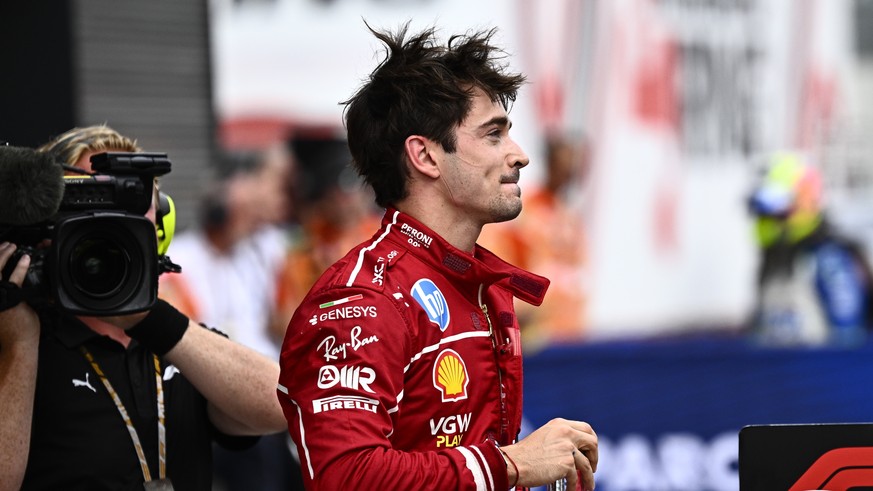 epa12279925 Ferrari driver Charles Leclerc of Monaco celebrates after winning the qualifying session for the Formula One Hungarian Grand Prix at the Hungaroring circuit in Mogyorod, Hungary, 02 August ...