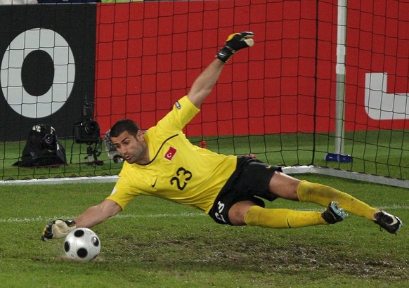 epa01377766 Turkish gaol keeper Volkan Demirel saves a shot, during the EURO 2008 preliminary round group A match between Switzerland and Turkey at the St. Jakob Park stadium, Basel , Switzerland 11 J ...