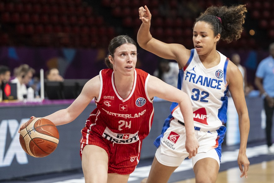 Evita Herminjard of Switzerland, left, fights for the ball with Tima Pouye of France, during the women&#039;s basketball match between France and Switzerland at the FIBA Women&#039;s Eurobasket Europe ...