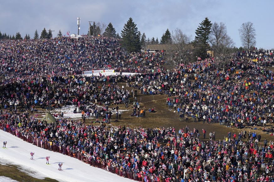 Tens of thousands of fans watch athletes compete in the cross-country men&#039;s mass start 50 Km at the Nordic World Ski Championships in Trondheim, Norway, Saturday, March 8, 2025. (AP Photo/Matthia ...