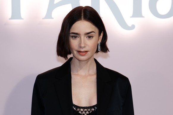 epa11601033 British-US actress Lily Collins poses during the photocall of the presentation of the Netflix series &#039;Emily in Paris&#039; season four in Paris, France, 12 September 2024. The fourth  ...