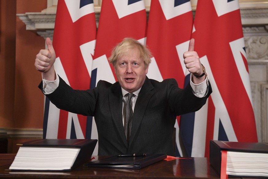 FILE - In this Wednesday, Dec. 30, 2020 file photo, Britain&#039;s Prime Minister Boris Johnson gives a thumbs up gesture after signing the EU-UK Trade and Cooperation Agreement at 10 Downing Street,  ...