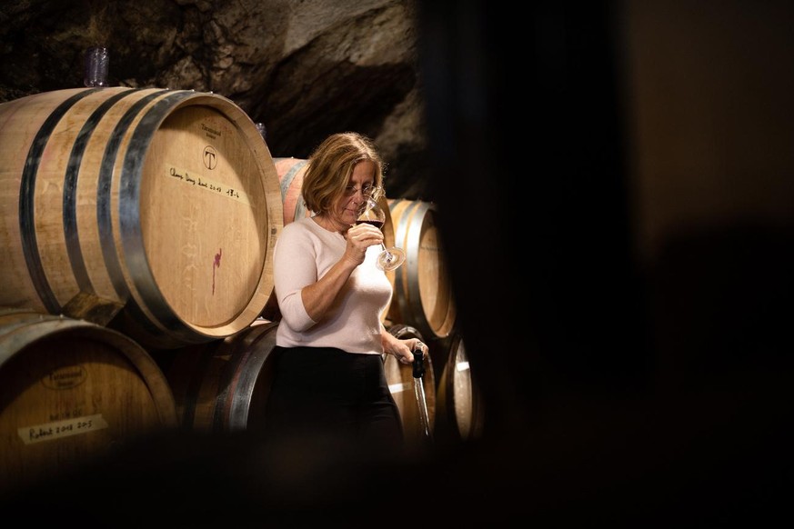 Portrait of Marie-Therese Chappaz, winemaker, taken in the cellar of her winery in Saxon, in the Canton of Valais, Switzerland, on November 2, 2018. Chappaz&#039;s vineyards are located in Fully, in t ...