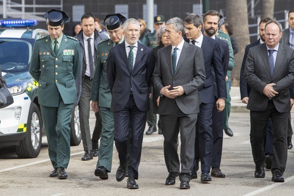 epa11142497 Spain&#039;s Interior Minister Fernando Grande-Marlaska (C) arrives at the Guardia Civil headquarters in Cadiz city, southern Spain, 10 February 2024, to visit the funeral chapel of two Gu ...
