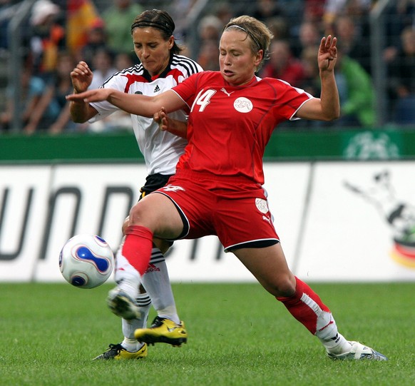 Germany&#039;s Sandra Smisek, left, and Noemie Beney from Switzerland challange for the ball during the European Championship qualification women soccer match between Germany and Switzerland in Koblen ...