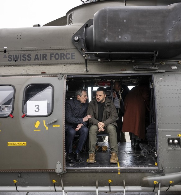 Switzerland&#039;s Foreign Minister Federal Councillor Ignazio Cassis, left, and his State guest Volodymyr Zelenskyy, President of Ukraine, right, get ready for takeoff in a Super Puma Helicopter of t ...