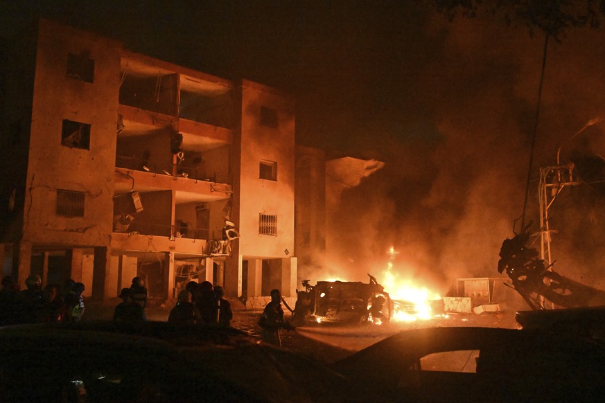 Firefighters work to extinguish a blaze after a missile launched from Iran struck Haifa, in northern Israel, on Sunday, June 15, 2025. (AP Photo/Rami Shlush)
APTOPIX Israel Iran Mideast Wars