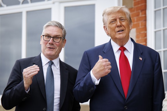 epa12269030 British Prime Minister Keir Starmer (L) and US President Donald J. Trump (R) gesture as they speak to the media ahead of the leader&#039;s meeting at the Trump Turnberry golf resort in Tur ...