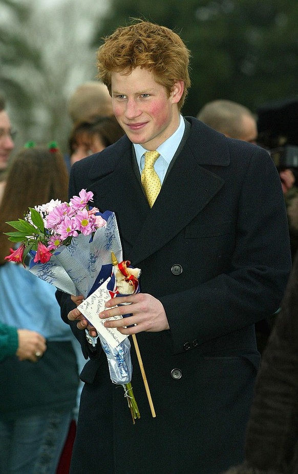 SANDRINGHAM, UNITED KINGDOM - DECEMBER 25: Britain&#039;s Prince Harry, and other members of the British Royal family, leave a Christmas Day service at Sandringham Church December 25, 2002 in Sandring ...