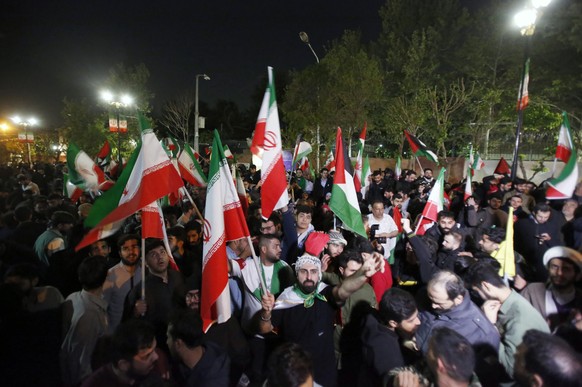 epa11277468 Iranians celebrate after Iran launched drone attacks against Israel; in front of the British embassy in Tehran, Iran, 14 April 2024. Iran&#039;s Islamic Revolutionary Guards Corps (IRGC) l ...