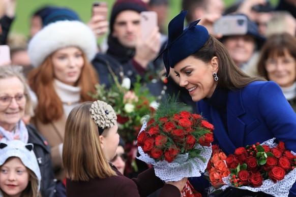 SANDRINGHAM, NORFOLK - DECEMBER 25: Catherine, Princess of Wales and Mia Tindall greet well-wishers after attending the Christmas Morning Service at Sandringham Church on December 25, 2023 in Sandring ...