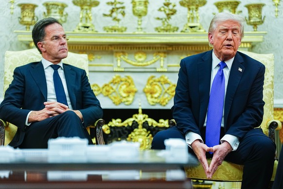 epa12474351 US President Donald J. Trump meets with NATO Secretary General Mark Rutte in the Oval Office of the White House in Washington, DC, USA, 22 October 2025. The leaders met to discuss continue ...