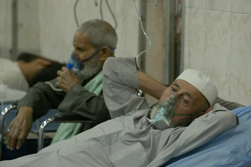 People with breathing problems are treated at a hospital during a sandstorm in Baghdad, Iraq, Monday, May 16, 2022. (AP Photo/Hadi Mizban)