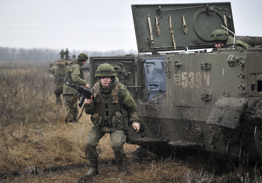 Russian troops take part in drills at the Kadamovskiy firing range in the Rostov region in southern Russia, Friday, Dec. 10, 2021. Russian troop concentration near Ukraine has raised Ukrainian and Wes ...