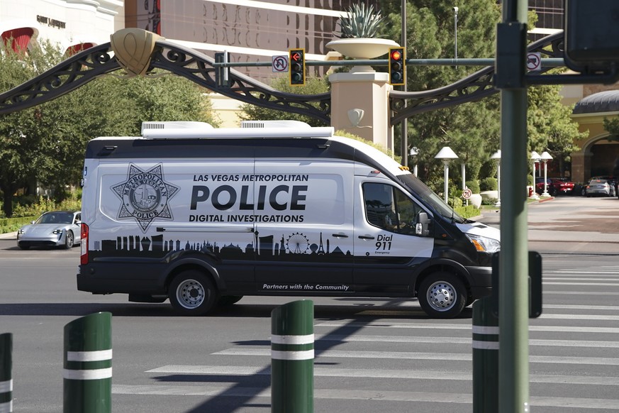 Police work at the scene where multiple people were stabbed in front of a Strip casino in Las Vegas, Thursday, Oct. 6, 2022. Police say an attacker has killed two people and wounded six others in stab ...