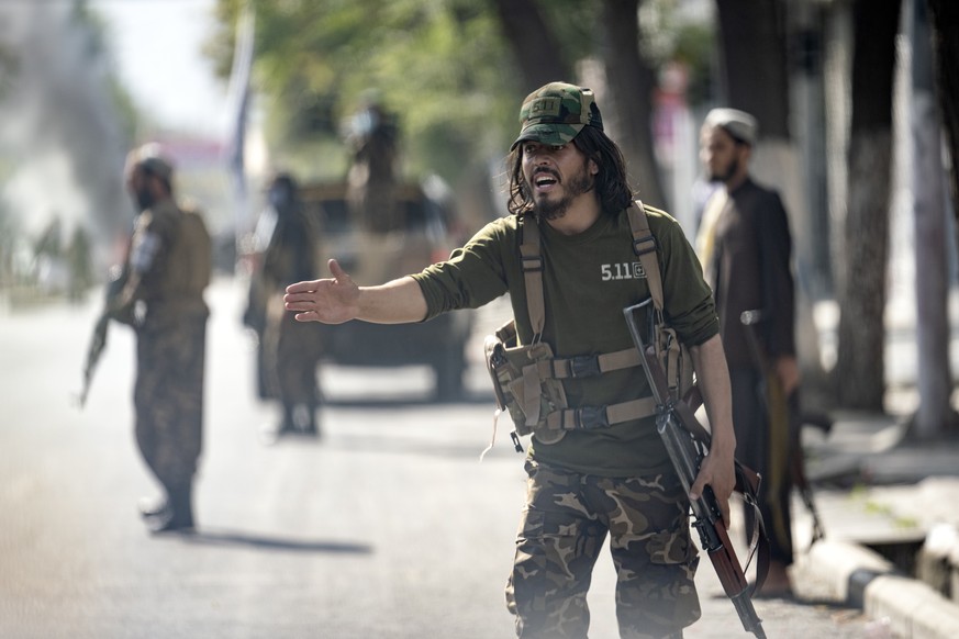 Taliban fighters stand guard at the explosion site, near a mosque, in Kabul, Afghanistan, Friday, Sept. 23, 2022. An explosion went off near a mosque in Afghanistan&#039;s capital of Kabul on Friday,  ...