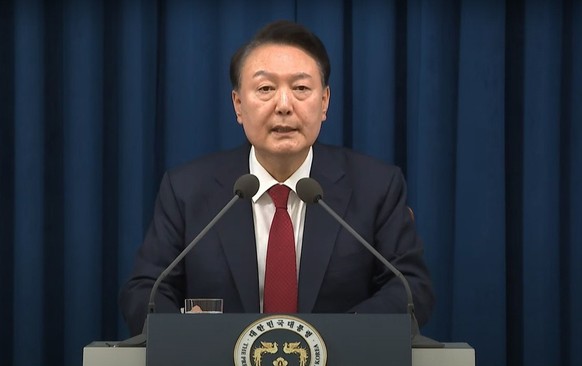 epa11754426 A handout screengrab made available by KTV shows South Korean President Yoon Suk Yeol declaring martial law in a televised emergency address delivered from the presidential office in Seoul ...