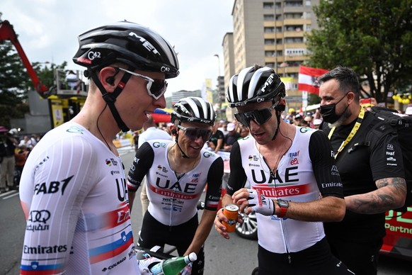 epa10720976 British rider Adam Yates (R) of team UAE Team Emirates celebrates with his teammate Slovak rider Tadej Pogacar (L) after winning the first stage of the Tour de France 2023, a 182km race wi ...