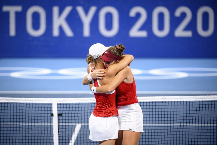 epa09370013 Belinda Bencic (R) and Viktorija Golubic (L) of Switzerland celebrate their win against Carla Suarez Navarro and Garbine Muguruza of Spain in the women&#039;s doubles tennis second round m ...